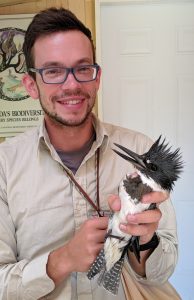 Matthias holding a recently banded Belted Kingfisher