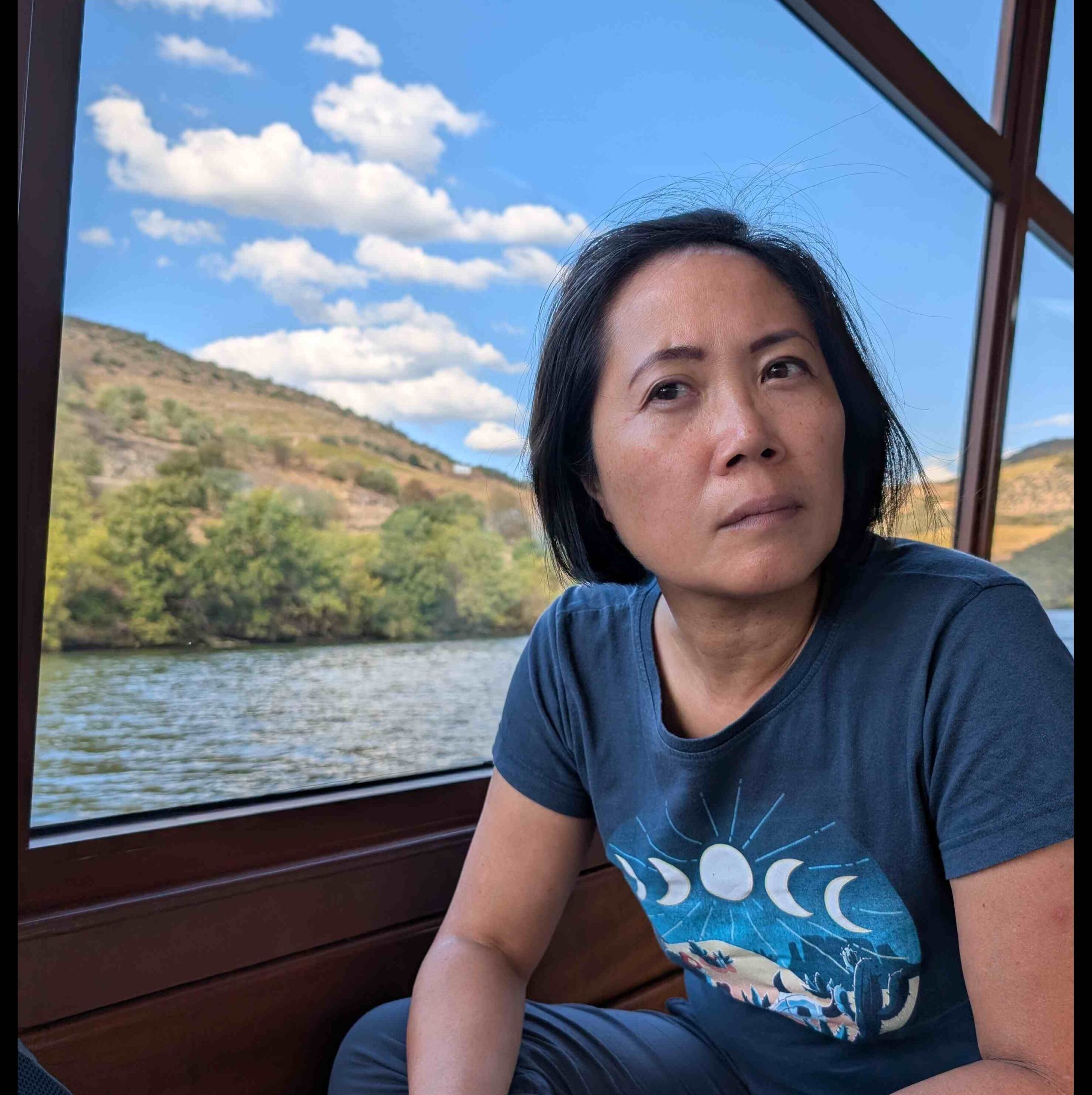 Director Amy Lee staring out into the distance, deep in thought